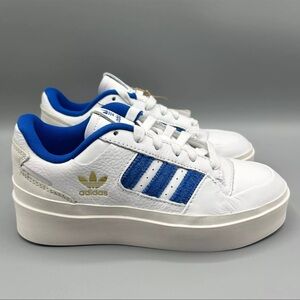 Adidas White Sneakers with Blue and Gold Accents